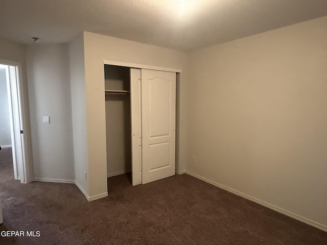 unfurnished bedroom featuring a closet