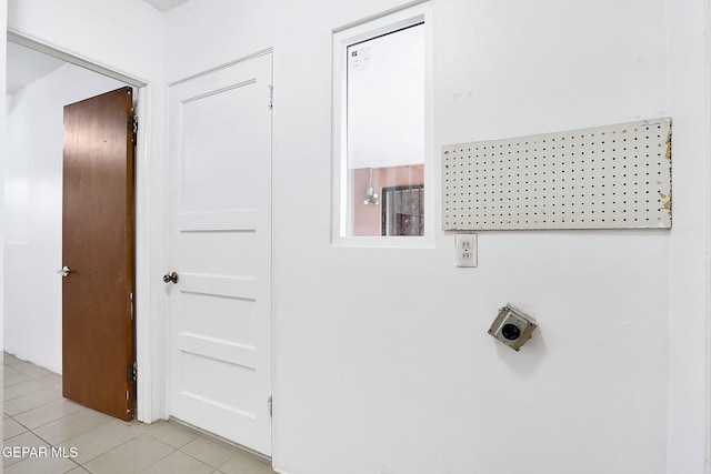 washroom with light tile patterned floors