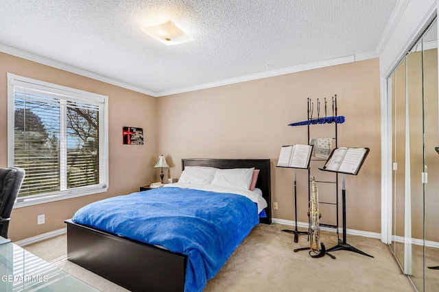 bedroom featuring ornamental molding, carpet floors, a closet, and a textured ceiling