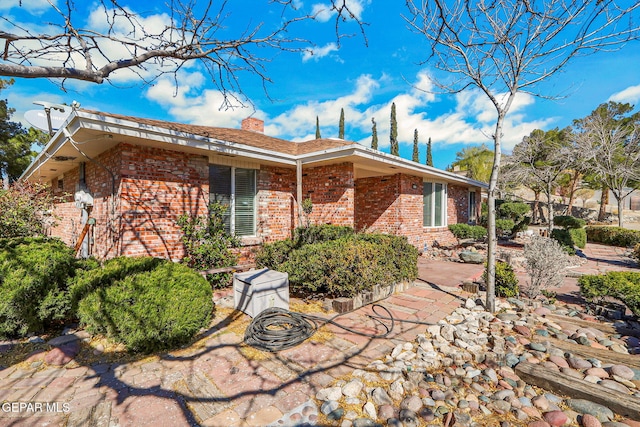 rear view of house with a patio