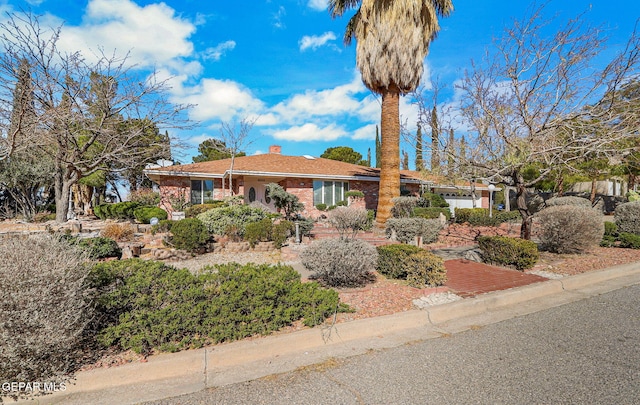 ranch-style house featuring a garage