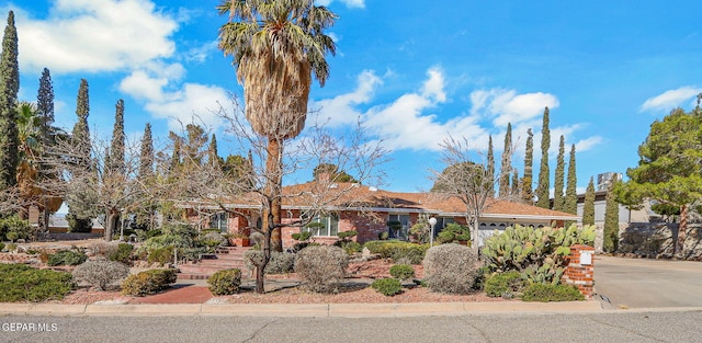 ranch-style house featuring a garage