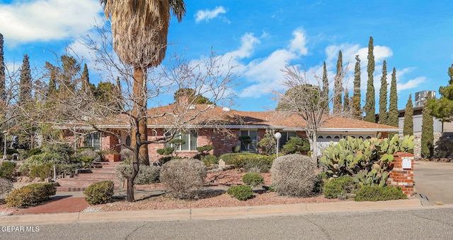 single story home featuring a garage