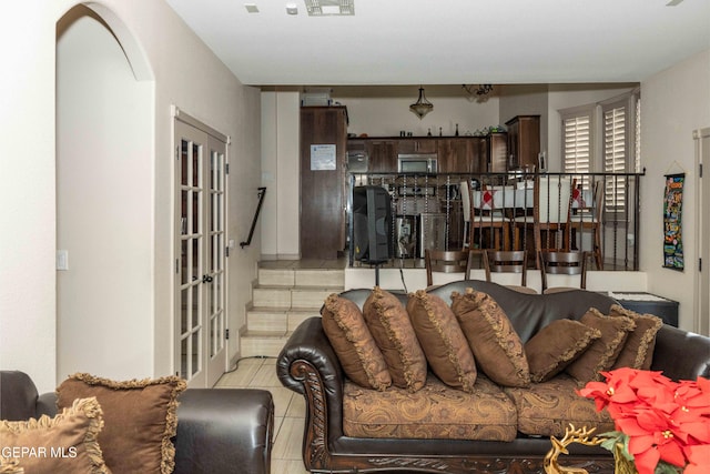 living room with light tile patterned floors