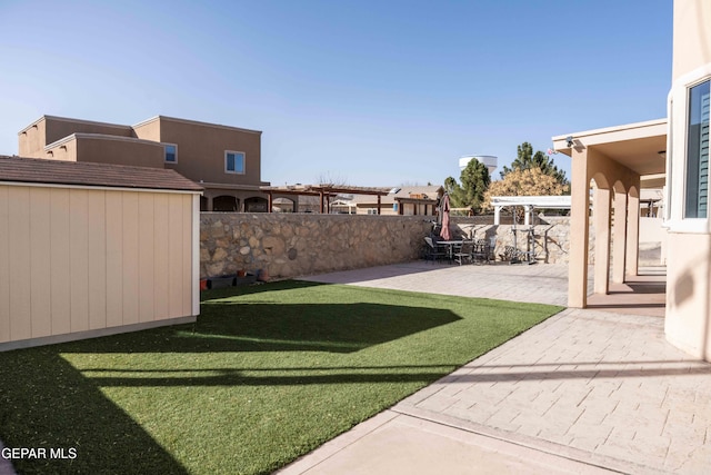 view of yard featuring a pergola and a patio area