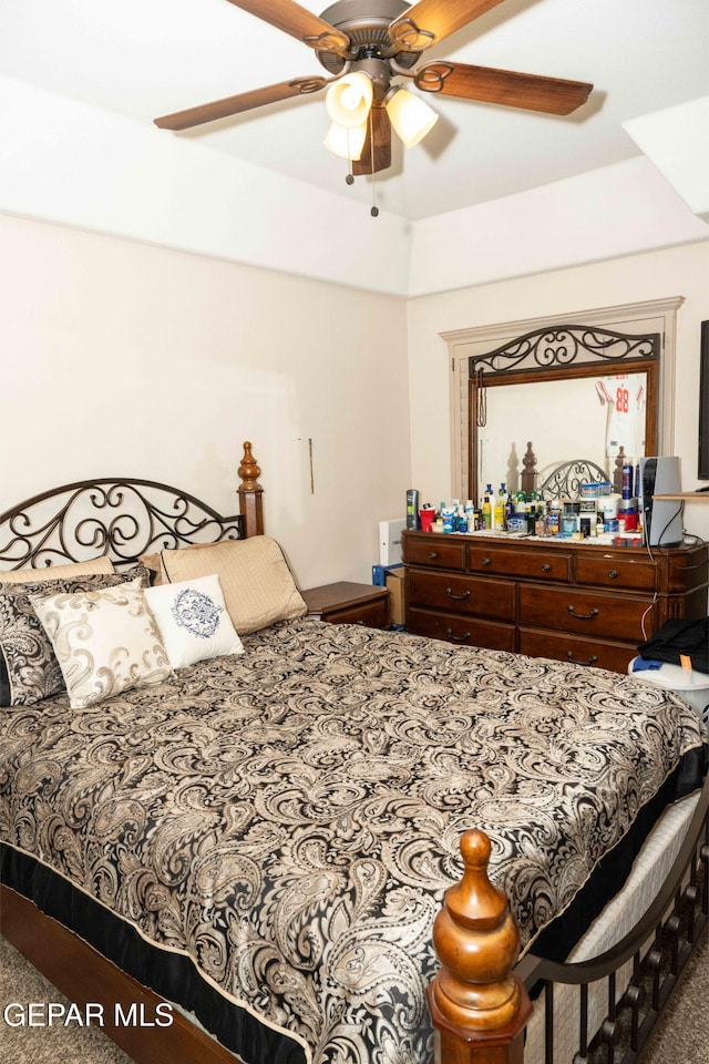 carpeted bedroom with ceiling fan