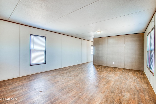 empty room with light hardwood / wood-style floors