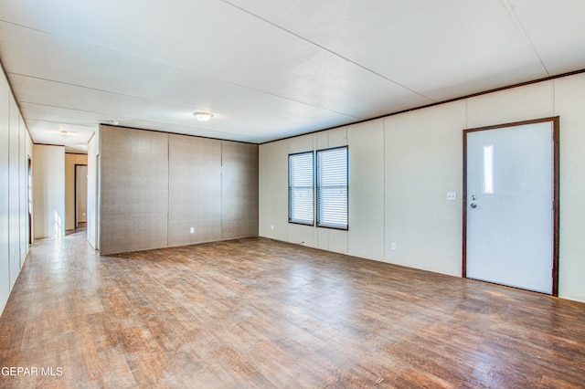 spare room with light hardwood / wood-style floors