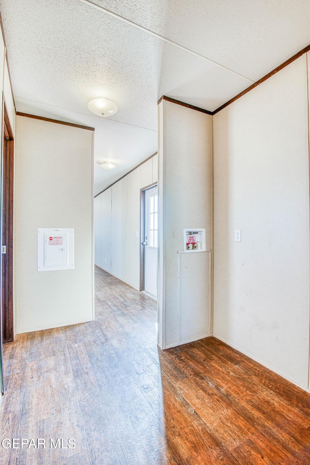 interior space with light hardwood / wood-style flooring and a textured ceiling