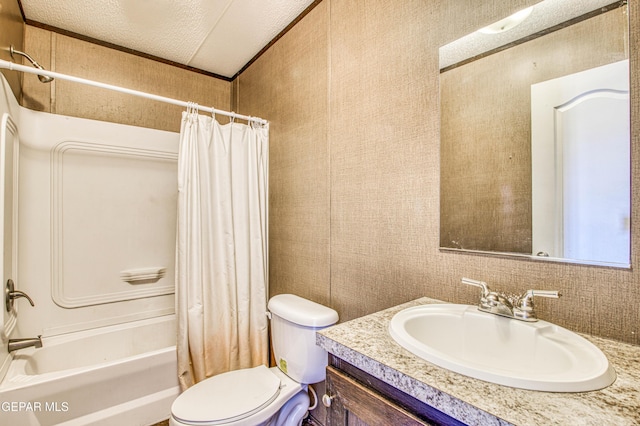 full bathroom with shower / tub combo with curtain, vanity, toilet, and a textured ceiling