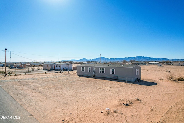 view of front of property with a mountain view