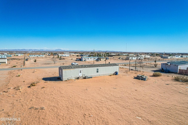 birds eye view of property featuring a mountain view