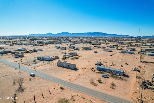 birds eye view of property featuring a mountain view