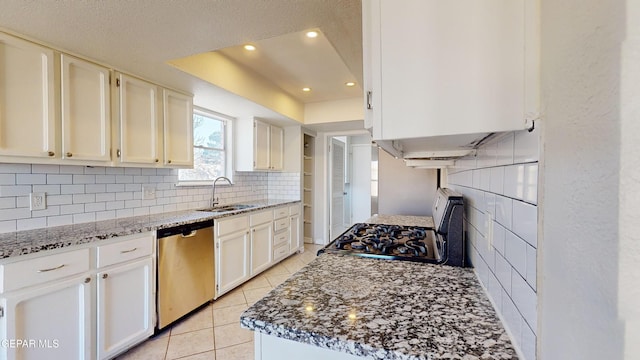 kitchen with sink, light stone countertops, white cabinets, and dishwasher