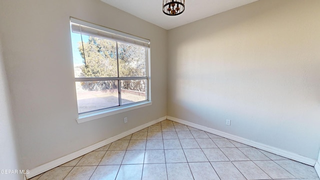 unfurnished room featuring light tile patterned flooring