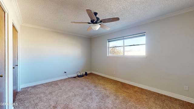 empty room featuring ornamental molding, light carpet, ceiling fan, and a textured ceiling