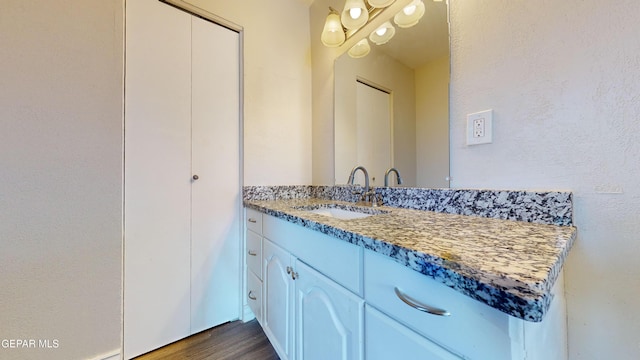 bathroom featuring vanity and wood-type flooring