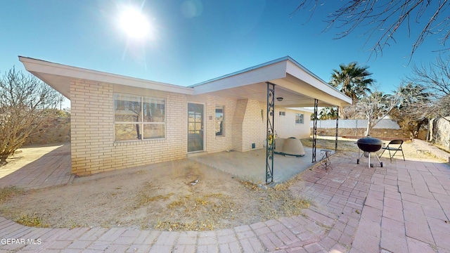 back of property featuring a patio