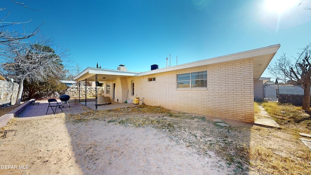 back of property featuring a patio area