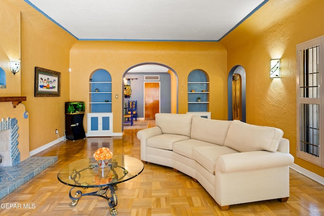 living room with parquet flooring and built in features