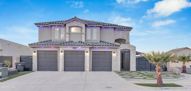 mediterranean / spanish-style home with a garage