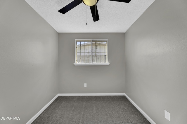 unfurnished room with ceiling fan, carpet flooring, and a textured ceiling