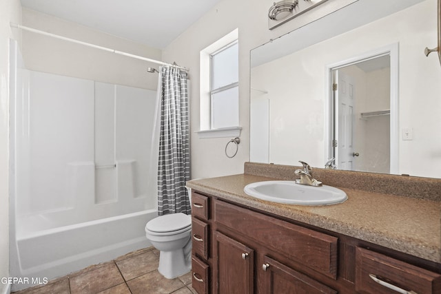 full bathroom featuring vanity, tile patterned flooring, toilet, and shower / bath combo with shower curtain