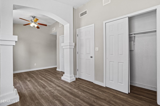 interior space featuring a textured ceiling, dark hardwood / wood-style floors, and ceiling fan