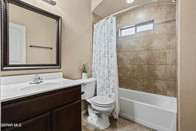 full bathroom with tile patterned flooring, vanity, shower / tub combo, and toilet