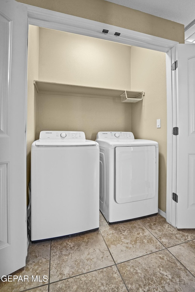 washroom with separate washer and dryer