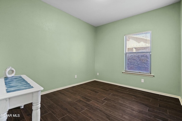 spare room with dark hardwood / wood-style floors