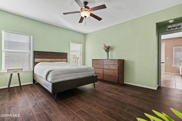 bedroom featuring dark wood-type flooring and ceiling fan