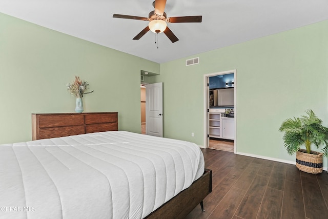 bedroom with ensuite bathroom, ceiling fan, and dark hardwood / wood-style flooring