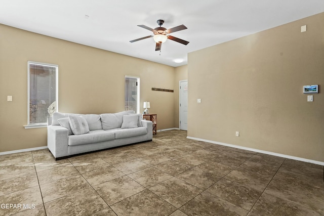 living room featuring tile patterned flooring and ceiling fan