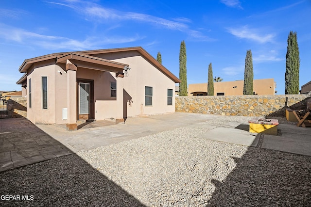 rear view of house featuring a patio area