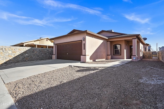 ranch-style house featuring a garage