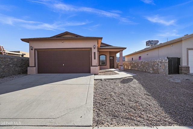 ranch-style house featuring a garage