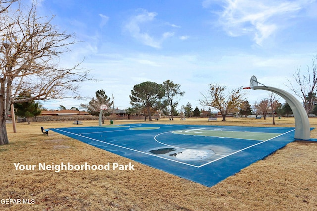 view of basketball court featuring a yard