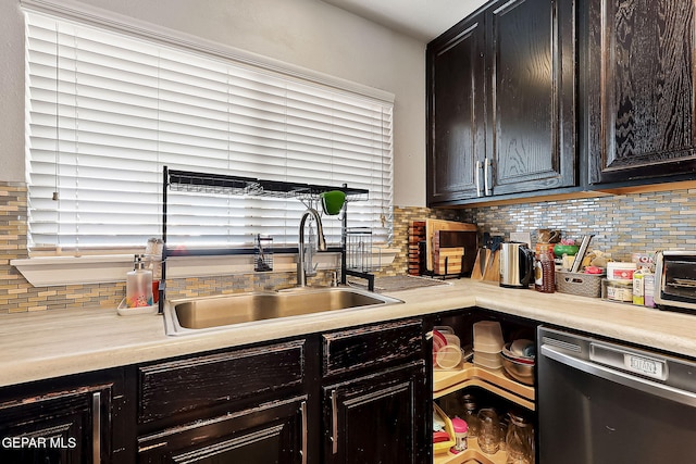 kitchen featuring dark brown cabinets, dishwasher, sink, and decorative backsplash