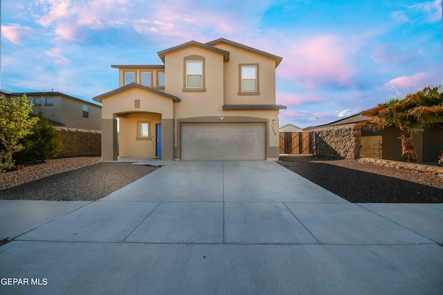 1009 Earthstar Pl, El Paso, TX 79928 - traditional-style home featuring a gate, driveway, fence, a garage, and stucco siding
