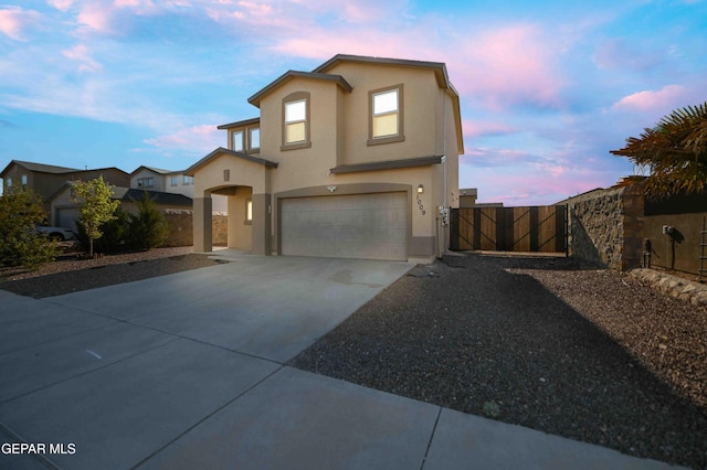 1009 Earthstar Pl, El Paso, TX 79928 - view of front of property with a gate, fence, stucco siding, an attached garage, and concrete driveway