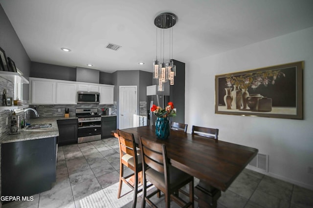1009 Earthstar Pl, El Paso, TX 79928 - dining room featuring visible vents, an inviting chandelier, and marble finish floor