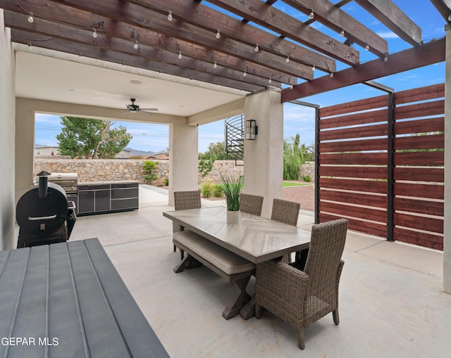 view of patio featuring area for grilling, ceiling fan, stairs, a pergola, and outdoor dining space