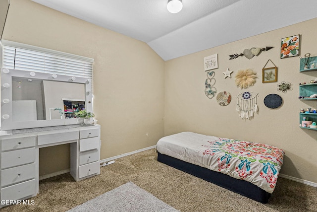 carpeted bedroom featuring vaulted ceiling