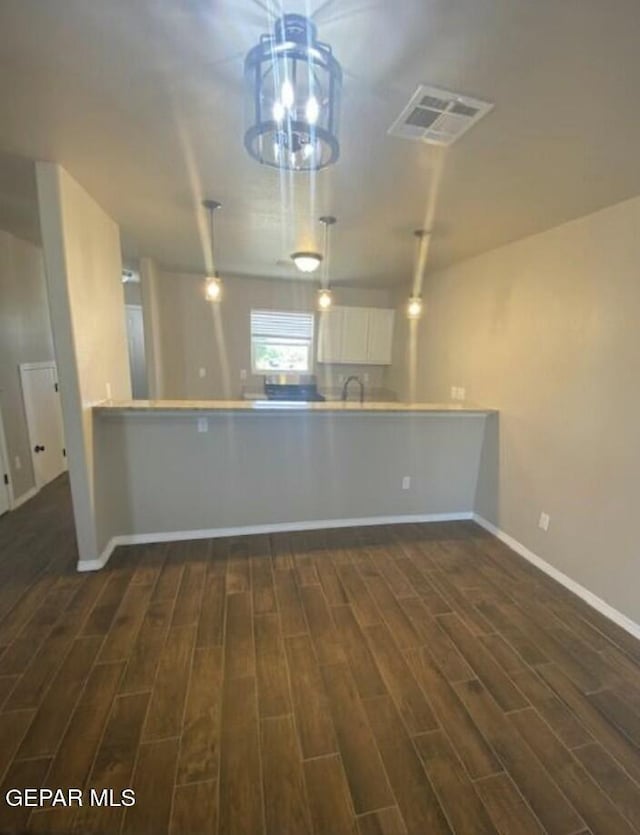 interior space with dark hardwood / wood-style flooring