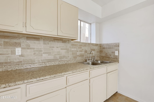 kitchen featuring sink and decorative backsplash