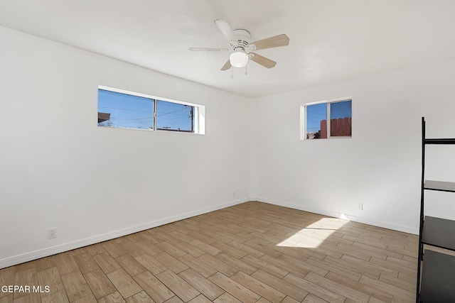 spare room with ceiling fan