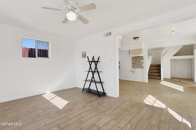 spare room featuring ceiling fan and light hardwood / wood-style floors