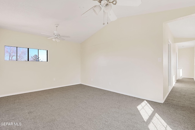 carpeted empty room featuring ceiling fan and lofted ceiling