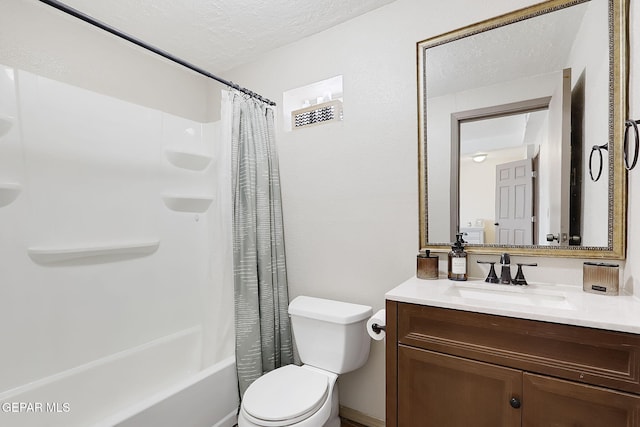 full bathroom featuring vanity, shower / bath combo, toilet, and a textured ceiling